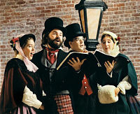 Four Christmas carolers and old-fashion clothing
